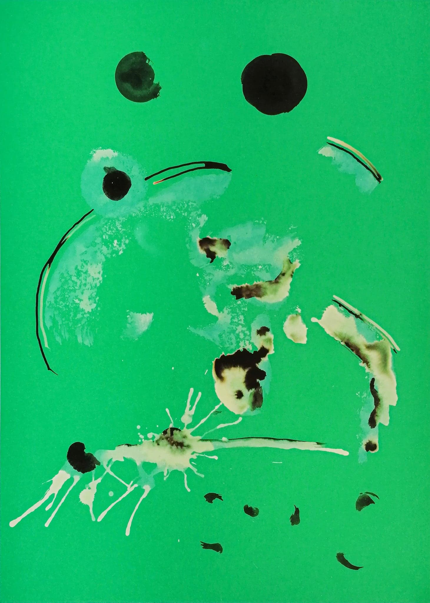 A green card with black discs, a pale curved sweep and a small burst of white filaments at the bottom