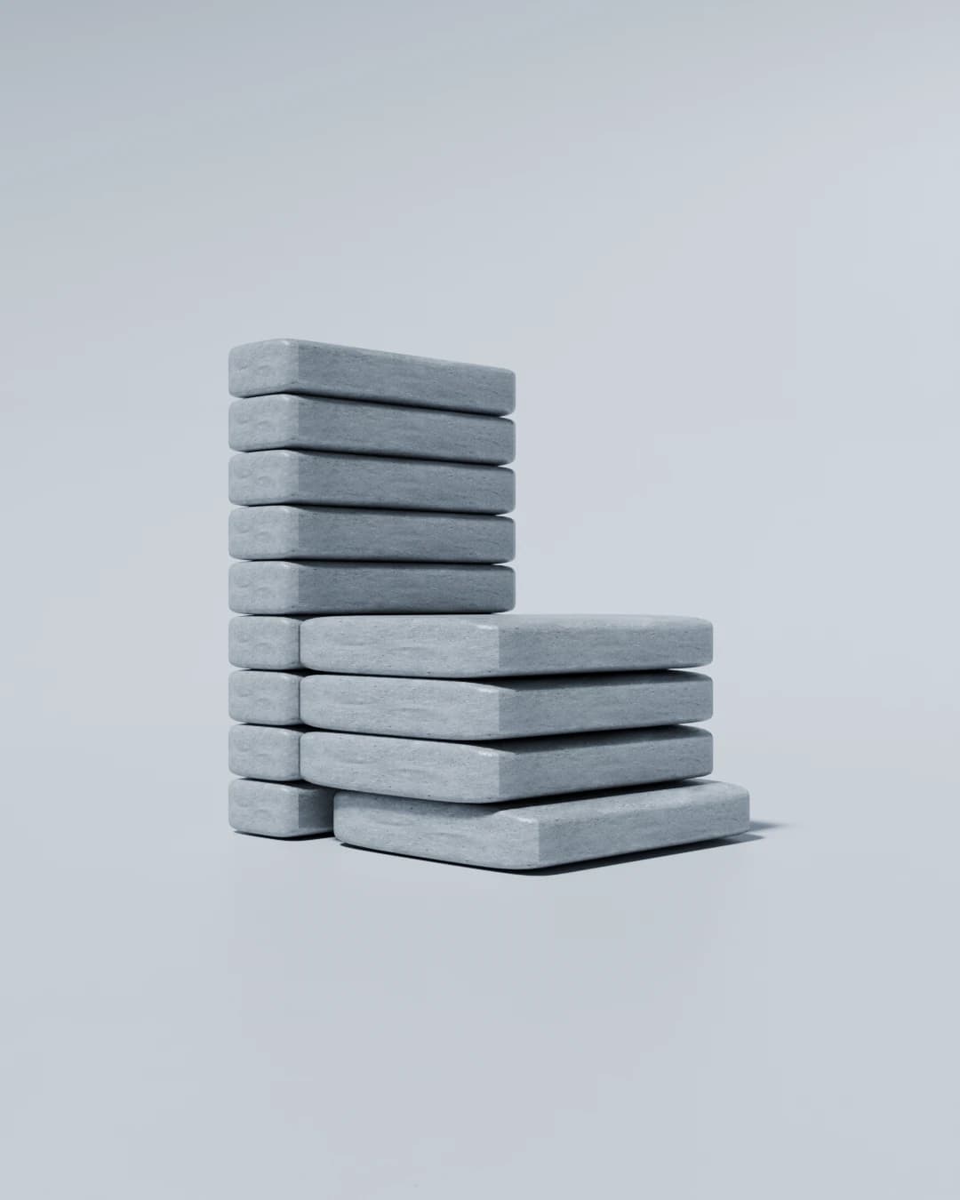 Concrete chair formed by a tall stack of slabs for the back and a shorter stack for the seat