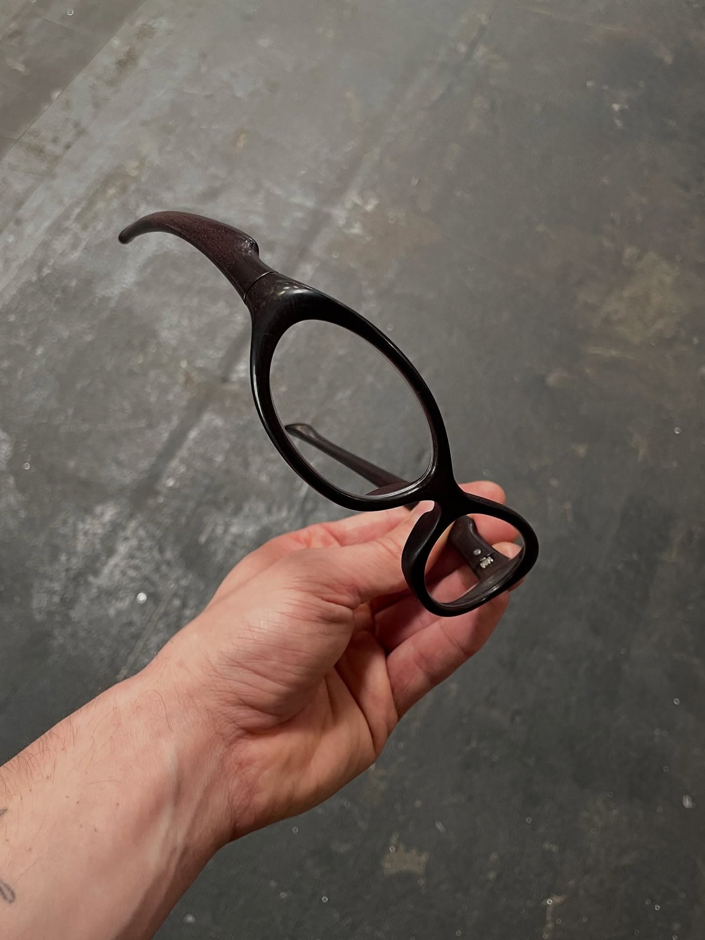 EVOS frame held close, raw 3D-printed grain visible