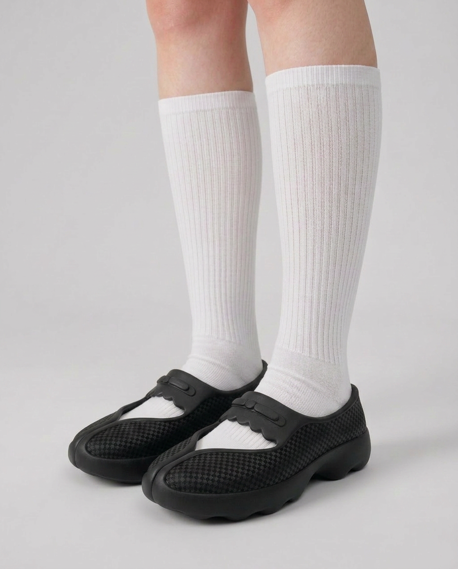 Worn on feet, front three-quarter view showing the instep strap