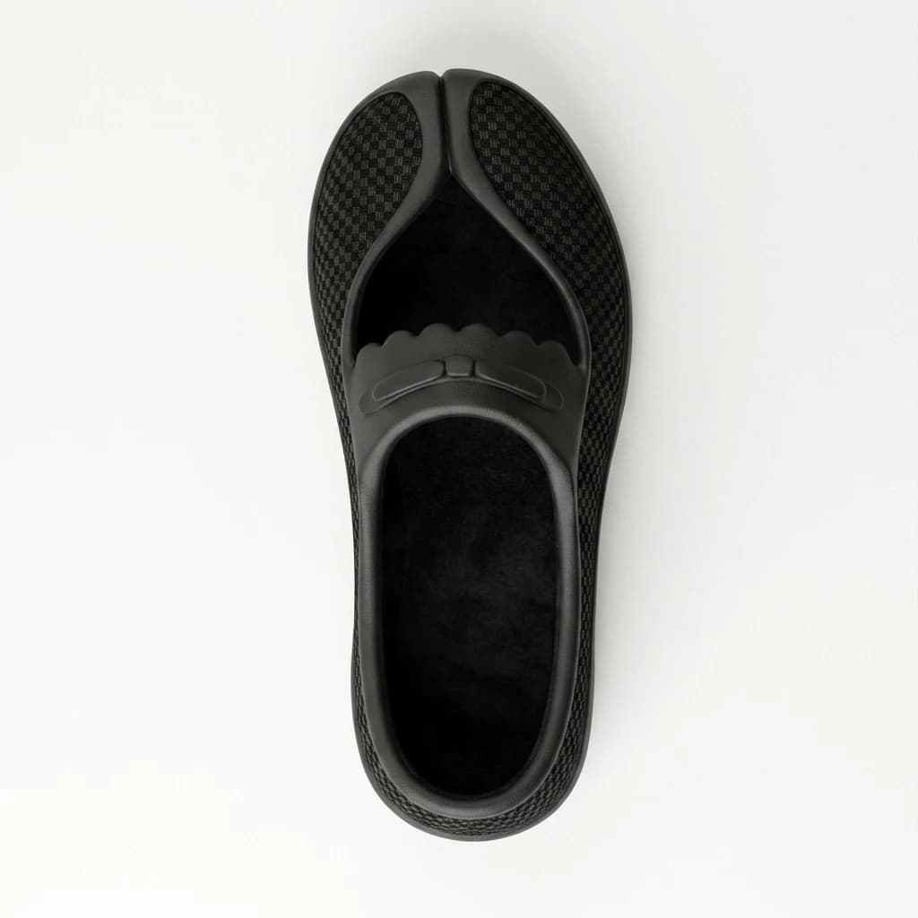 Top-down view of a single shoe on a pale ground