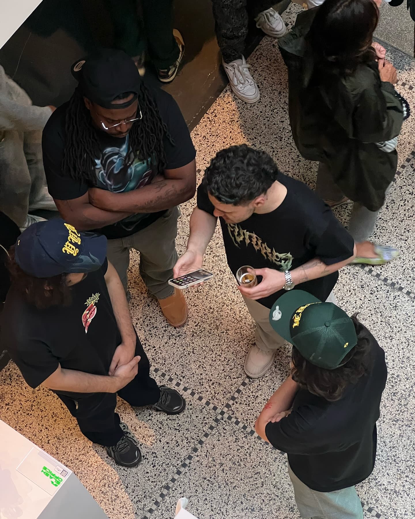 Visitors crouched over the sneakers, photographing them on the floor