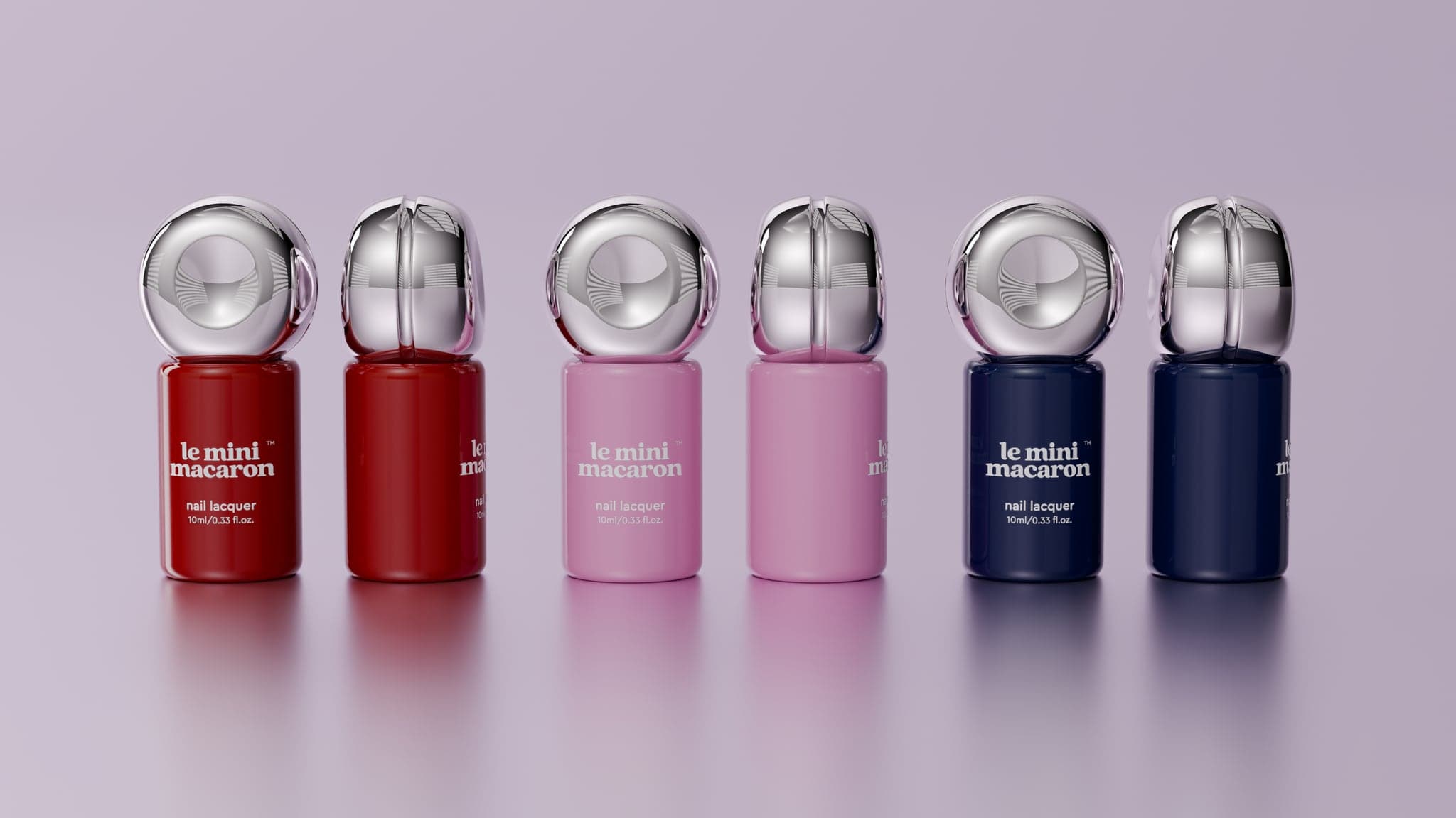 Six nail lacquer bottles in a row, red, pink and navy pairs, each capped with a chrome sphere, shown closed and part-opened