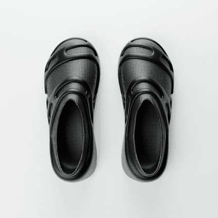 LOUERS seen from above, both shoes side by side, the strap slots cut through the upper