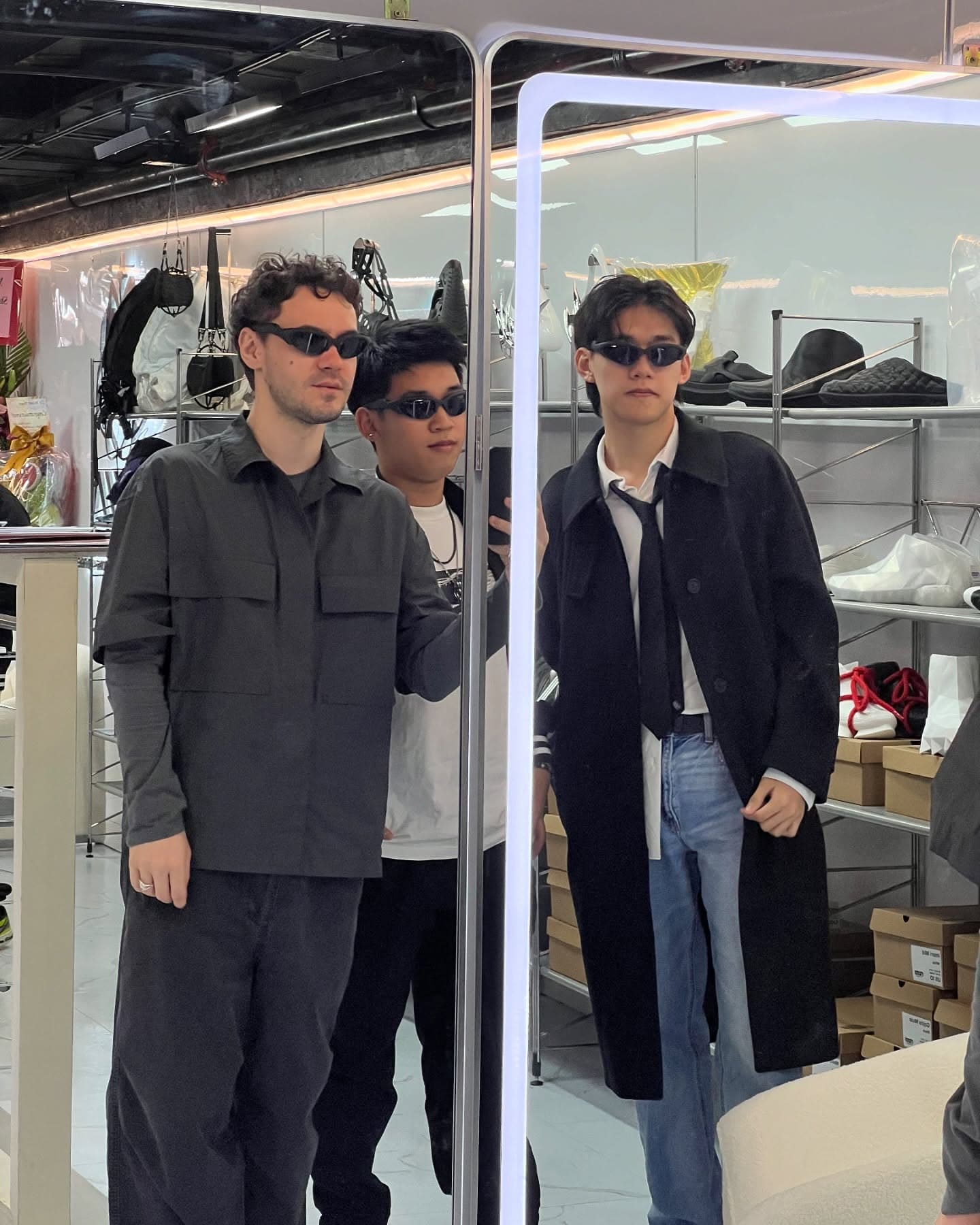 Visitors among the showroom rails, the collection displayed behind