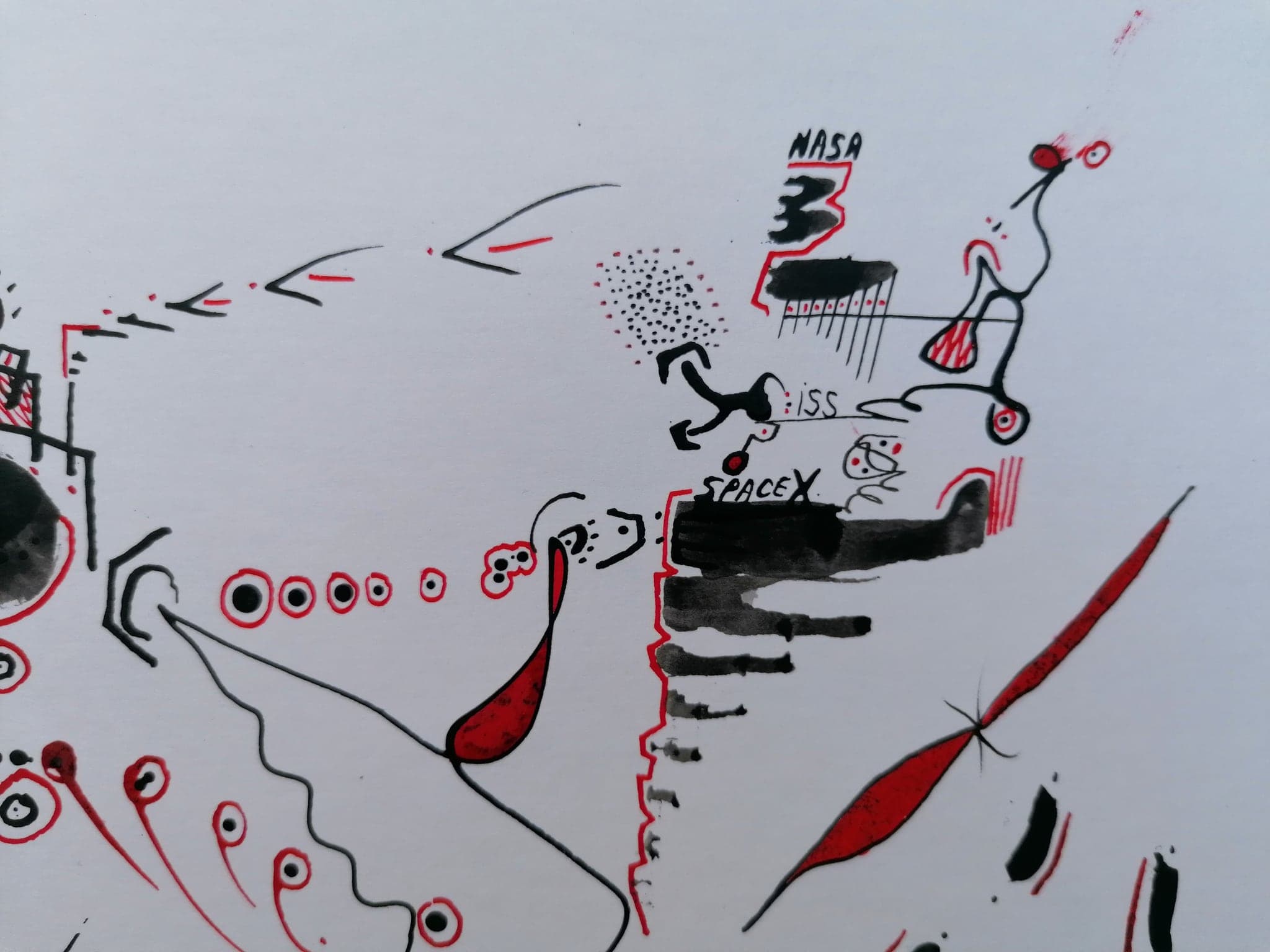 Close view of the red thread of flight arcing across the sheet past ringed forms in a row
