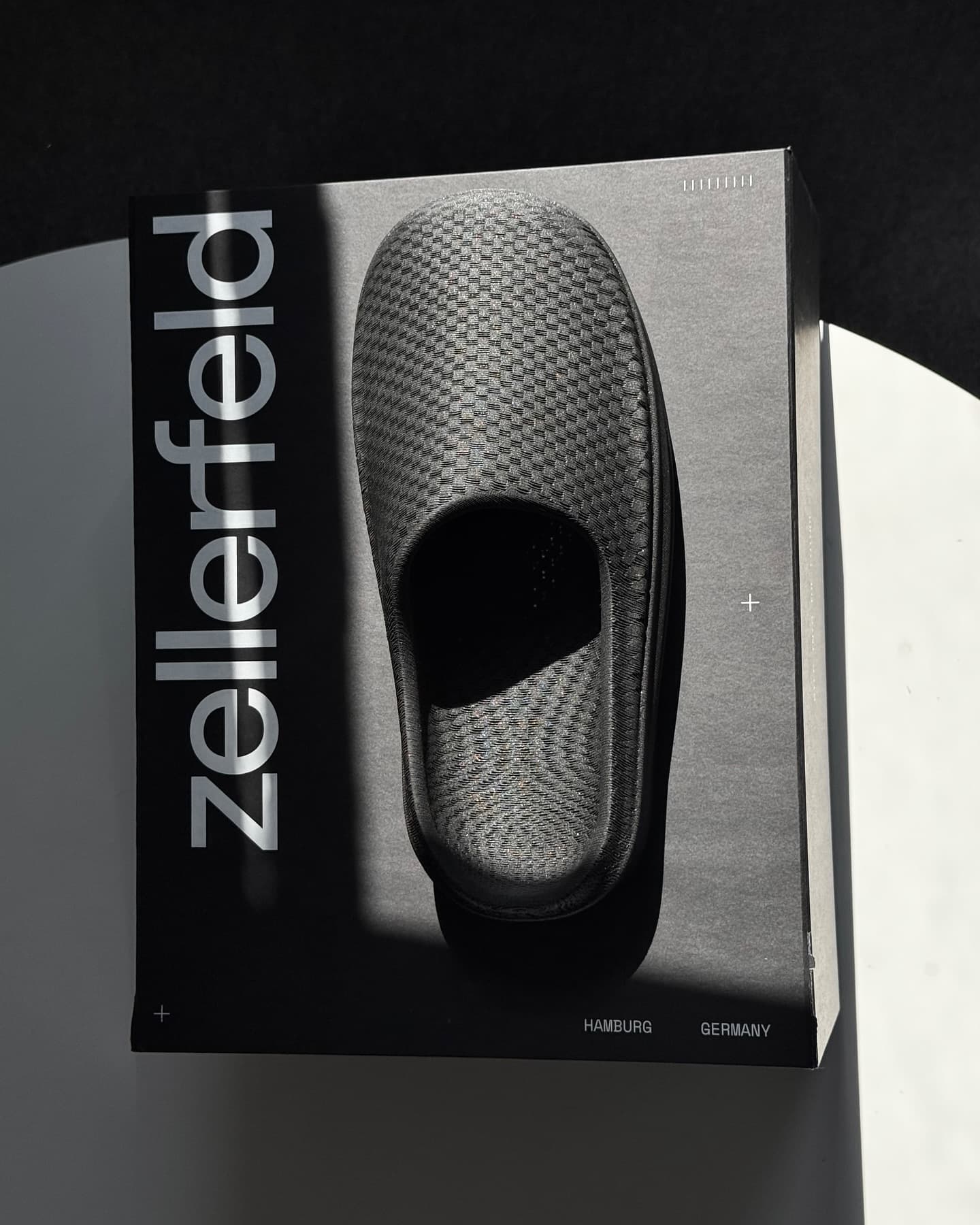 Zellerfeld shoebox with NEVO printed across the lid