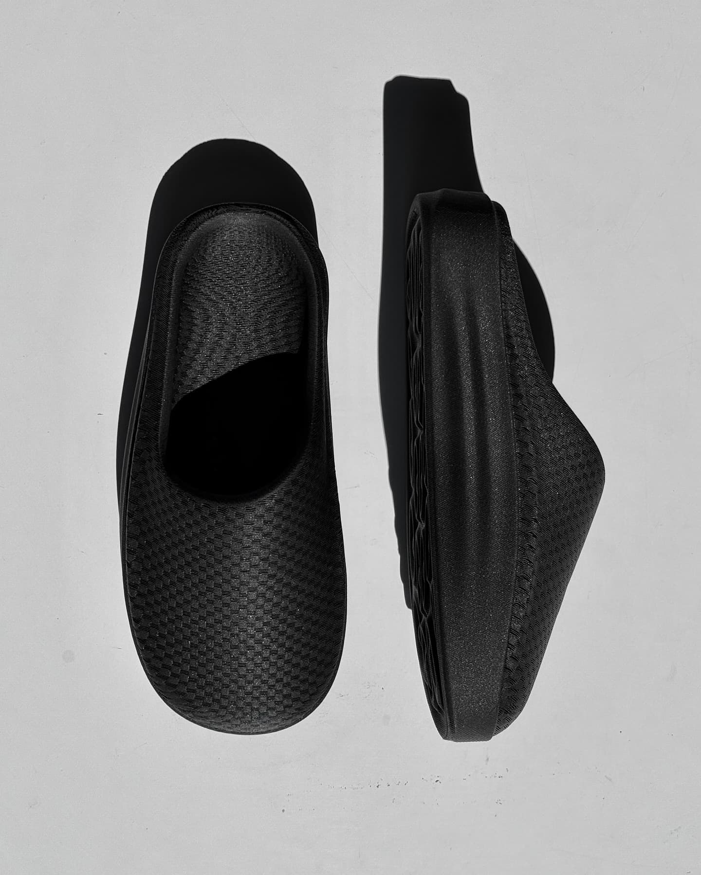 NEVO pair top-down, one shoe upright and one on its side