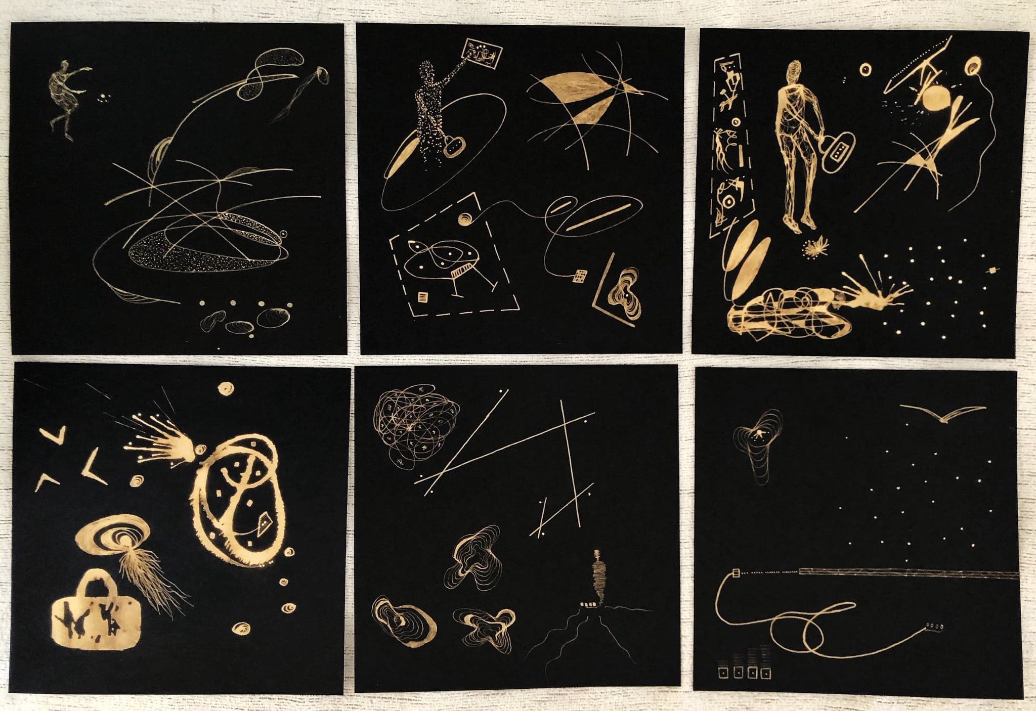 Nine black panels arranged in a grid, each carrying pale gold figures, loops, insects and scattered dots