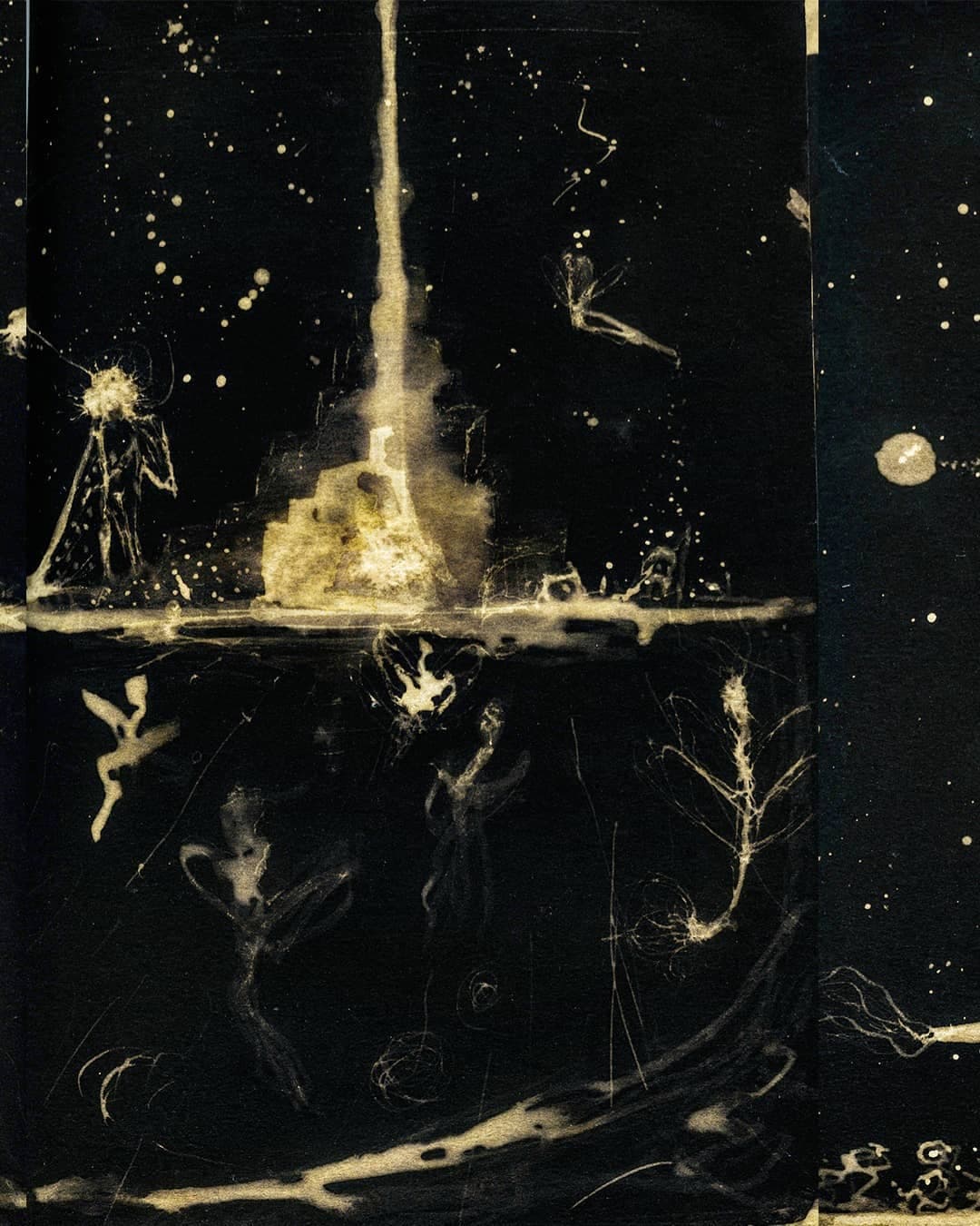 A spread where a spray of gold rises from the lower edge and breaks apart against the black