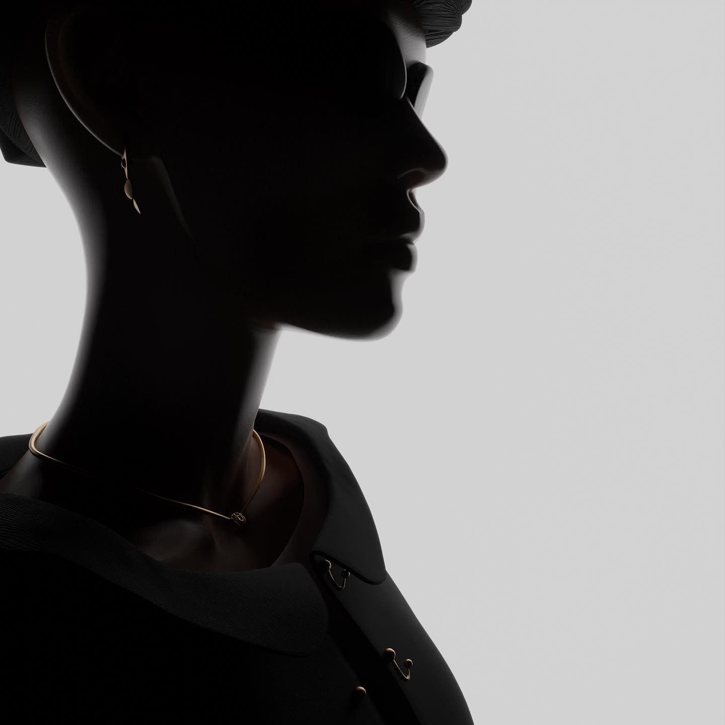 A dark figure in profile against a pale ground, one thin gold chain at the throat