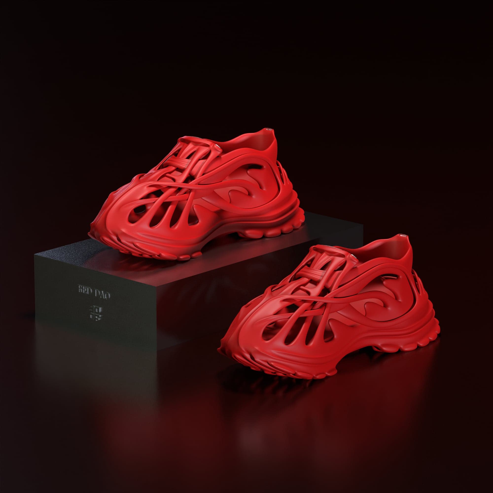 Two red sneakers on a dark reflective floor, one raised on a black block, lit from above against near-black surroundings