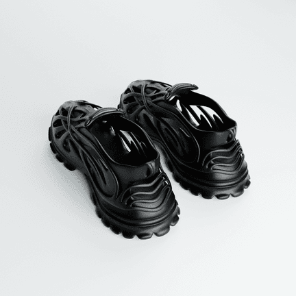 RELICS, both shoes together, the open branching upper reading as one cast piece