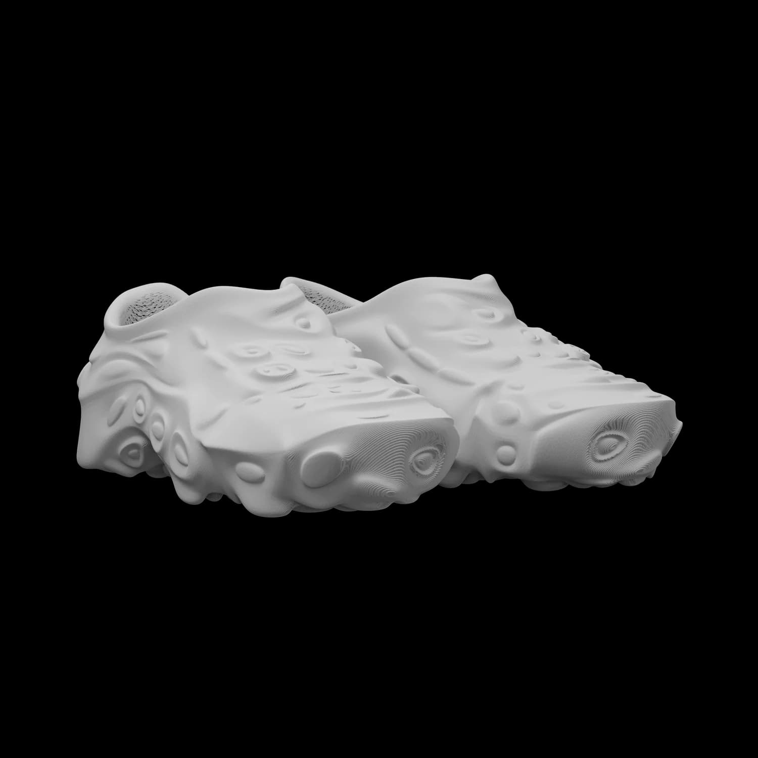 SAGRA in pale stone grey, three-quarter angle view of a single sneaker, the grown, branching structure of the upper catching the light along its ridges