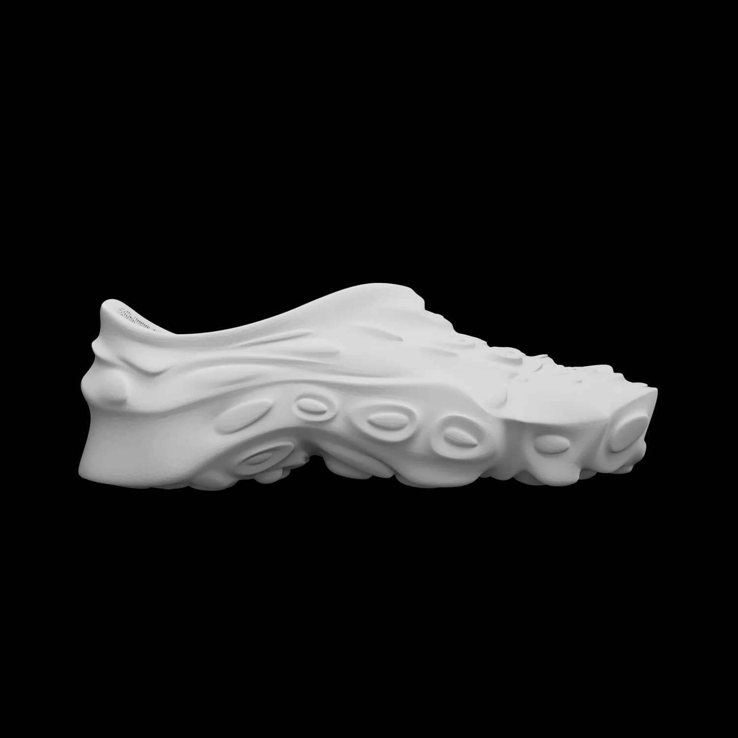 SAGRA in pale stone grey, side view of a single sneaker, the grown, branching structure of the upper catching the light along its ridges