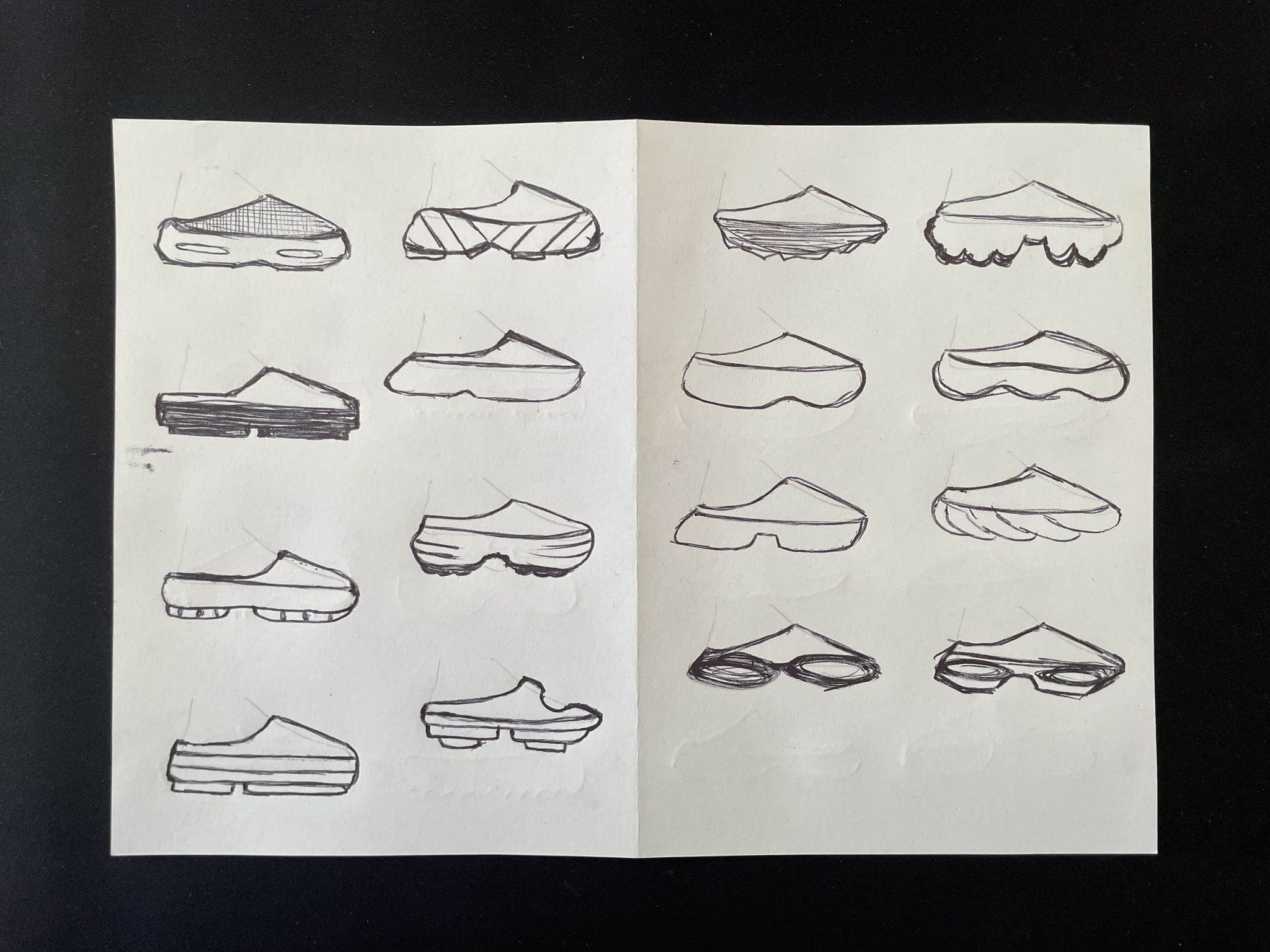 Sixteen shoe profiles in pen, several with hatched or ribbed midsoles, on a black ground