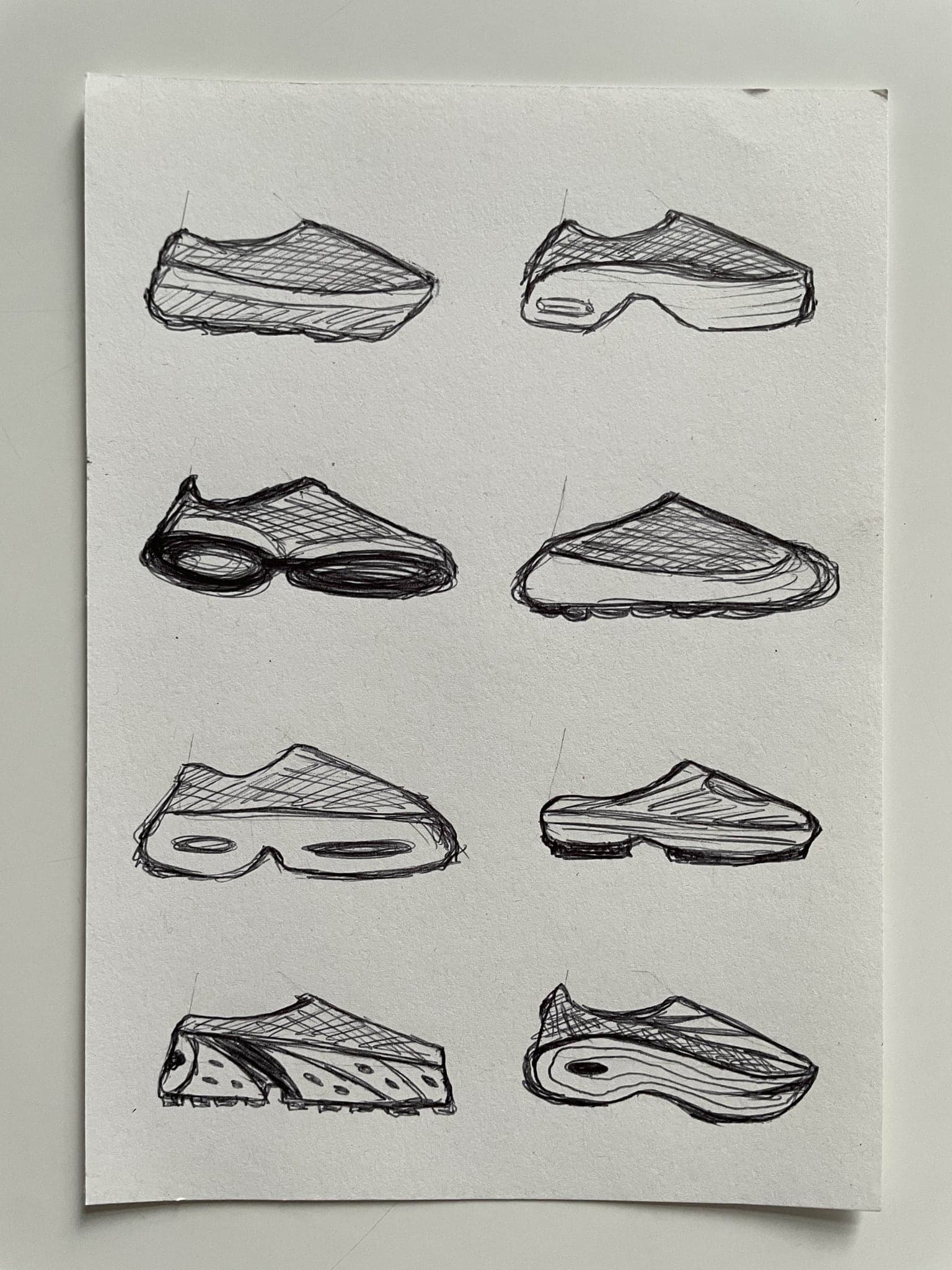 Eight larger shoe sketches on a single unfolded sheet, hatched uppers over chunky soles