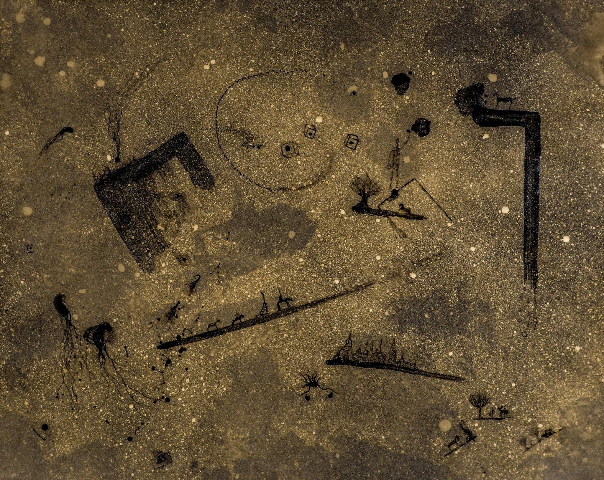 Another gold-speckled area of the same work: dark shapes scattered across it, a long boat form, a hooked bar and a ring of small marks