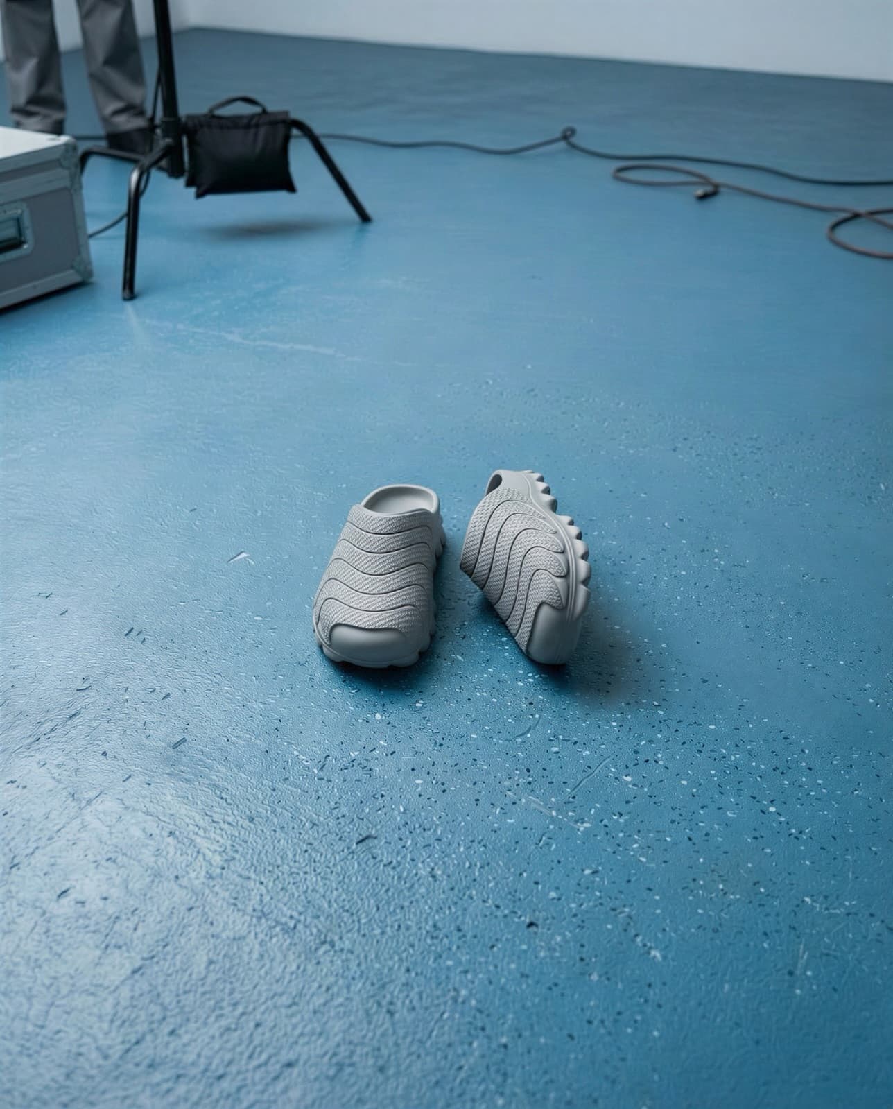 A single pair standing on the blue floor of the studio set