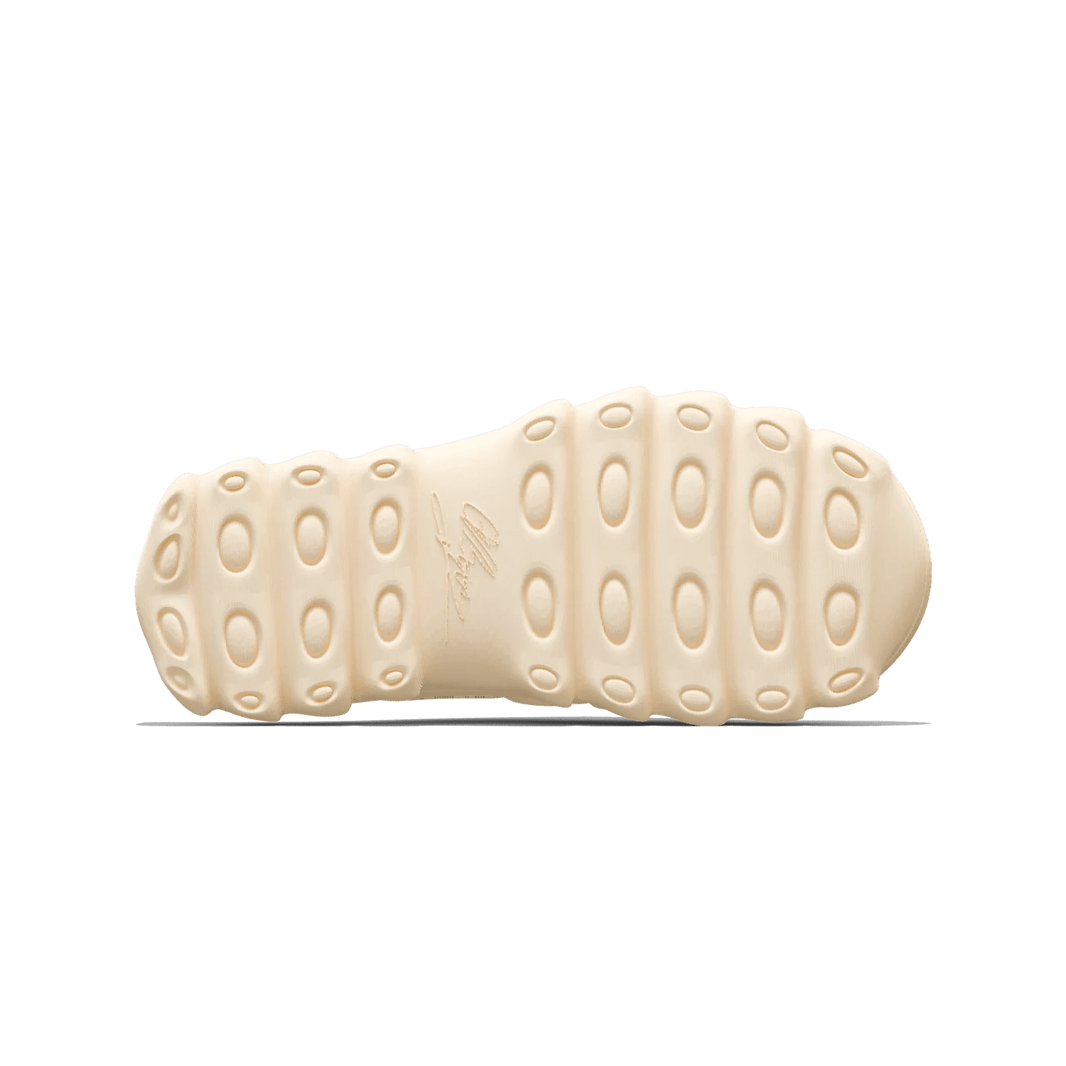 The lugged outsole of VIZE in warm oat with the moulded signature