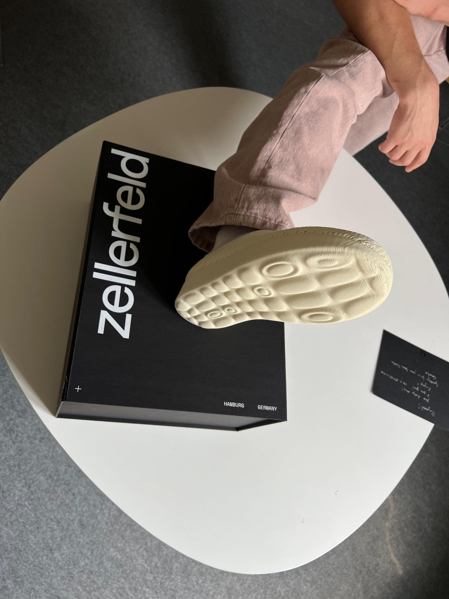 The sole of a printed shoe resting on the Zellerfeld packaging